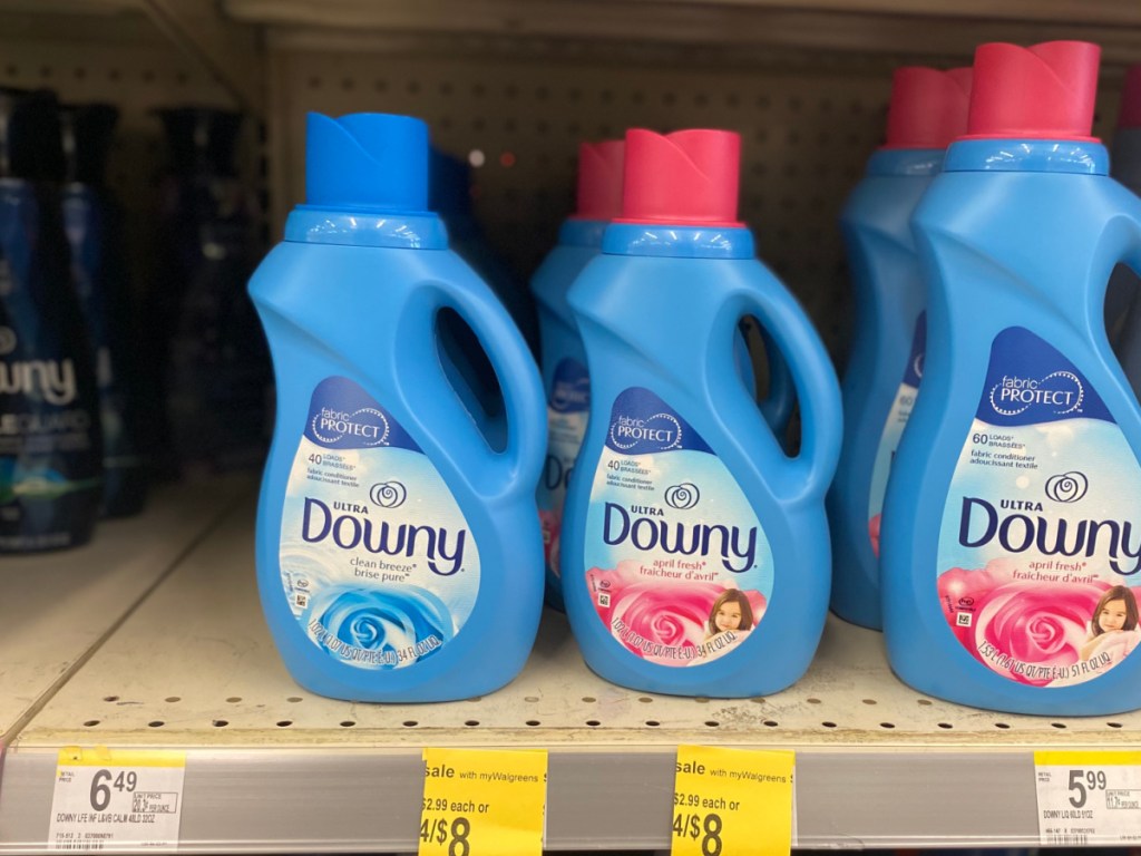 multiple bottles of downy fabric softener on walgreens store shelf