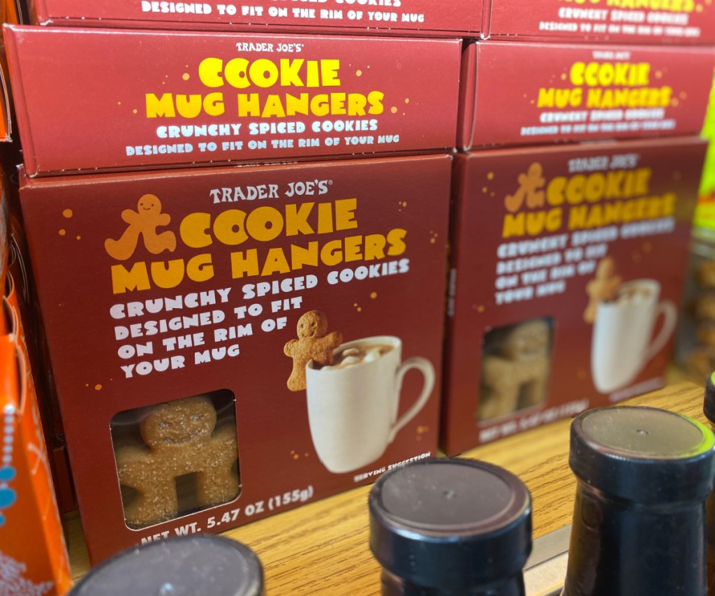 boxes of cookie mug hangers stacked on store shelf