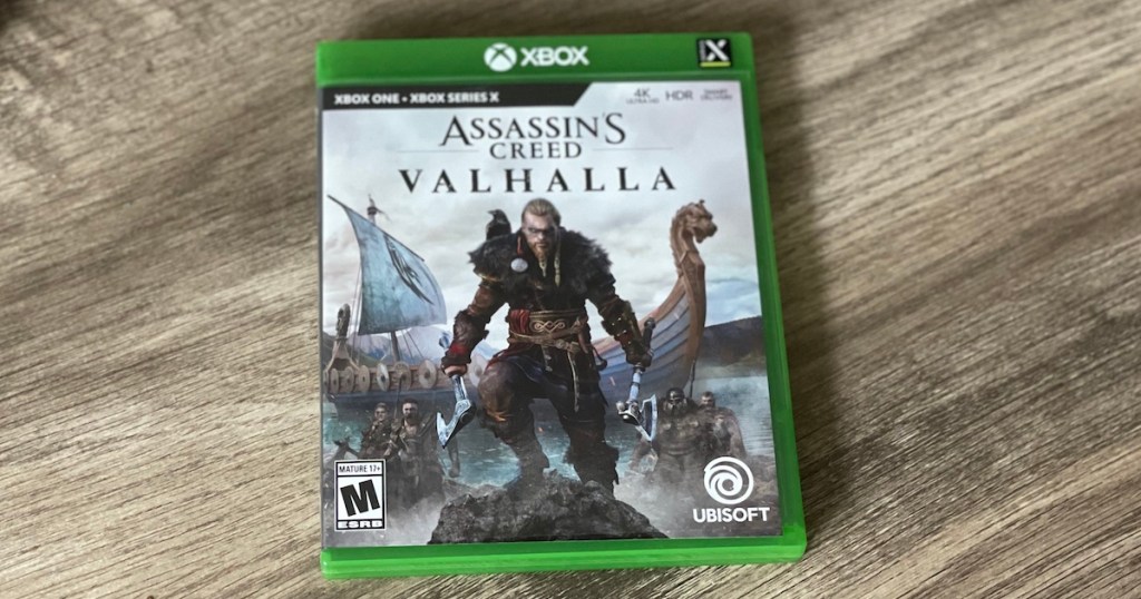 XBOX assassins Creed Valhalla on wooden table