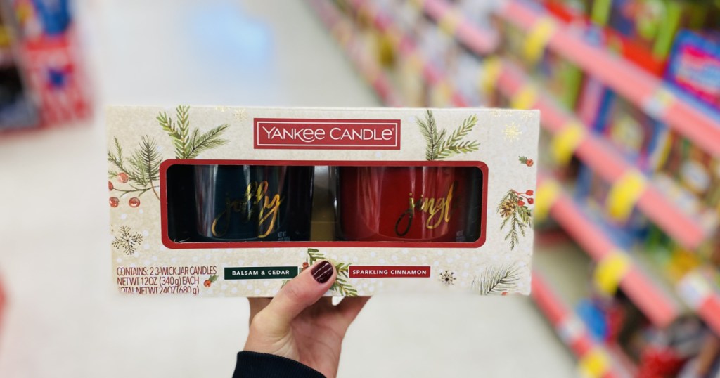 hand holding candle three pack