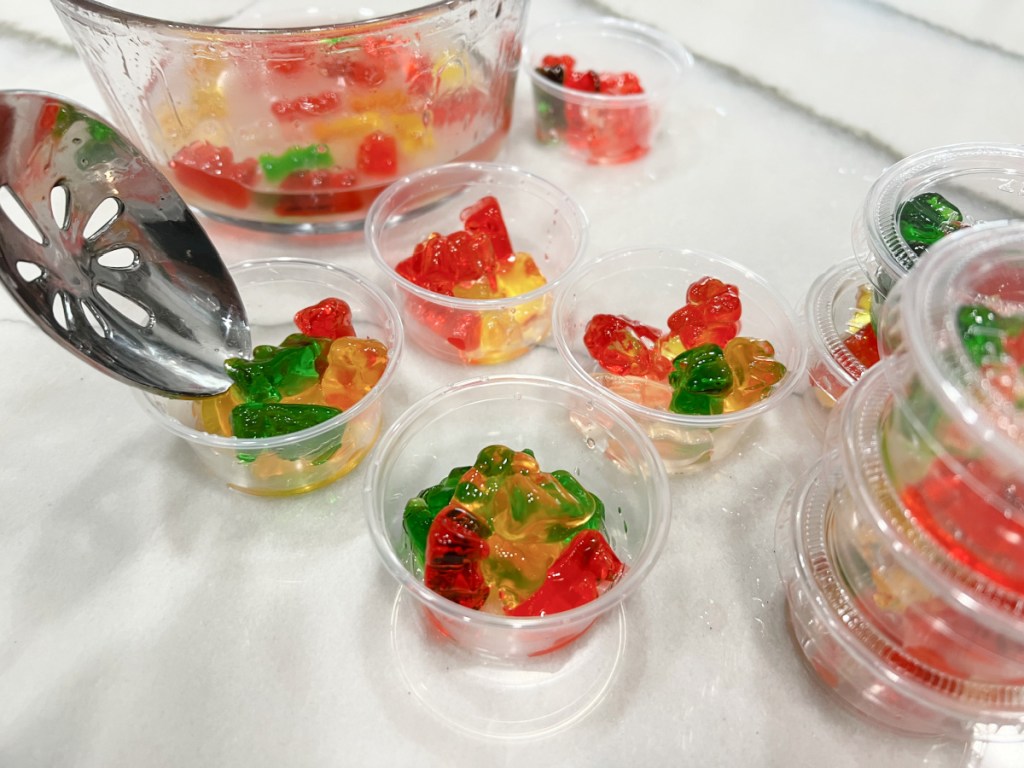 adding rum soaked gummy bears to containers