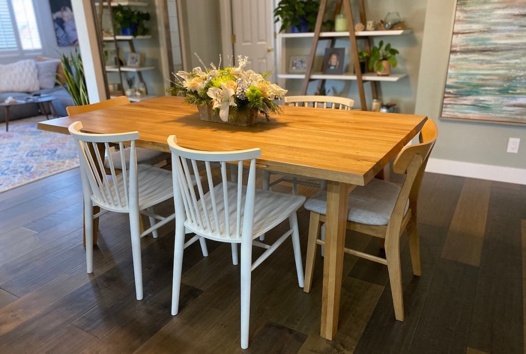 wood table with white chairs