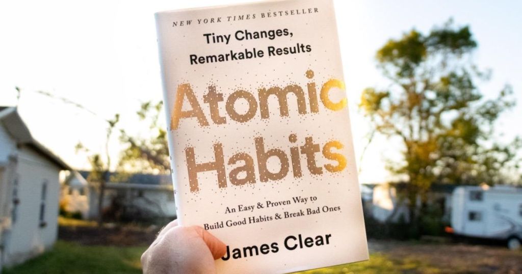 holding Atomic Habits book