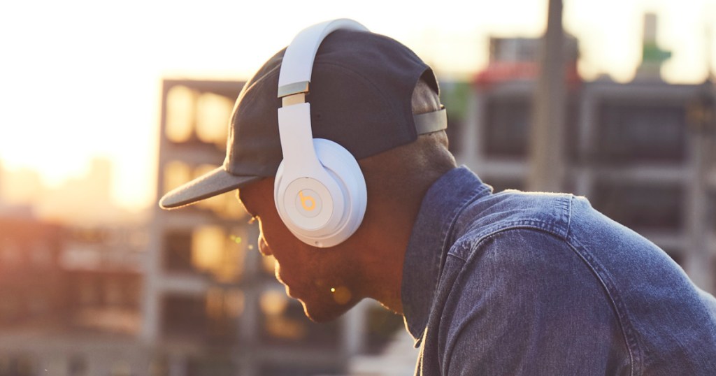 beats studio3 headphones on guy on rooftop