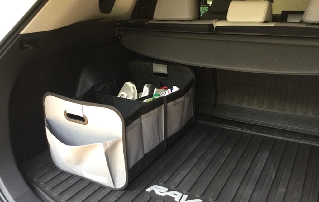 storage bin in back of trunk with all weather mats 