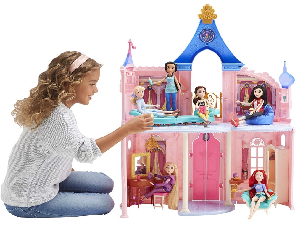 little girls playing with barbie disney castle