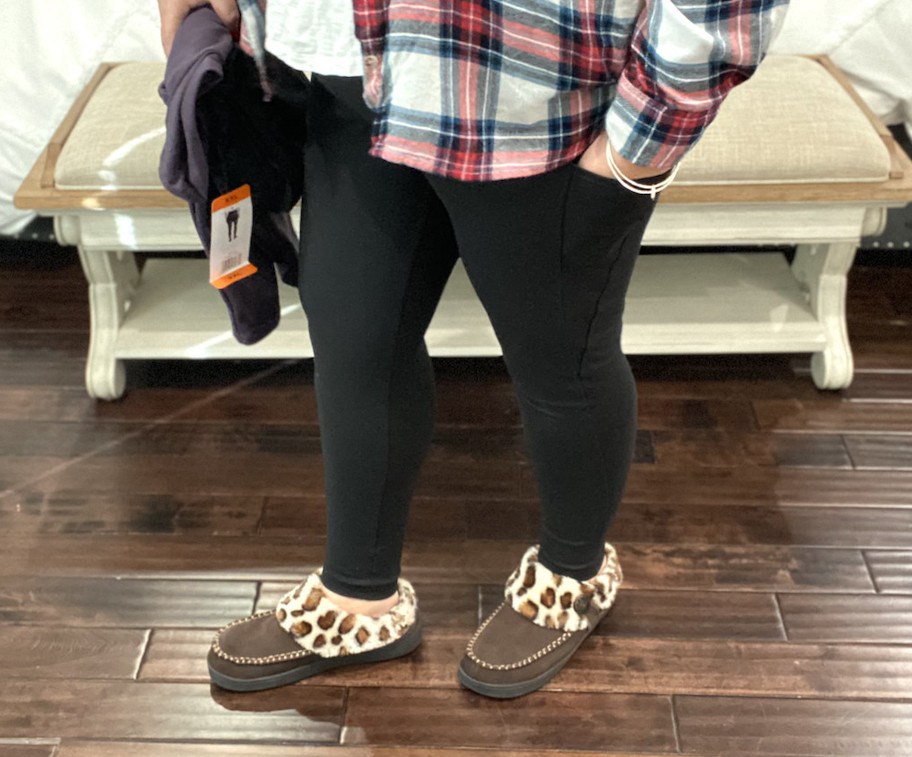 woman wearing black lululemon leggings dupes with leopard slippers
