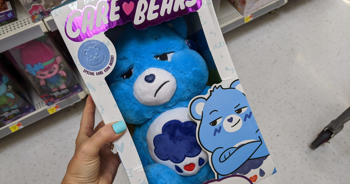 grumpy bear care bear in hand in store
