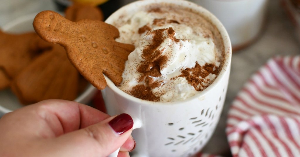 holding mug filled with gingerbread latte 