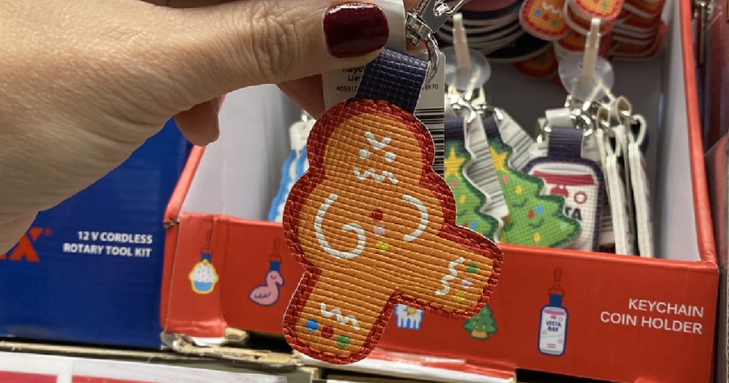 hand holding gingerbread key chain by store display