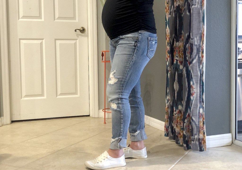 woman wearing maternity jeans