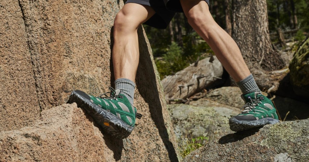 merrell outdoor shoes on man climbing