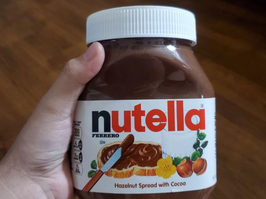 holding jar of nutella