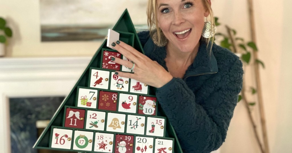 woman holding Christmas advent calendar 