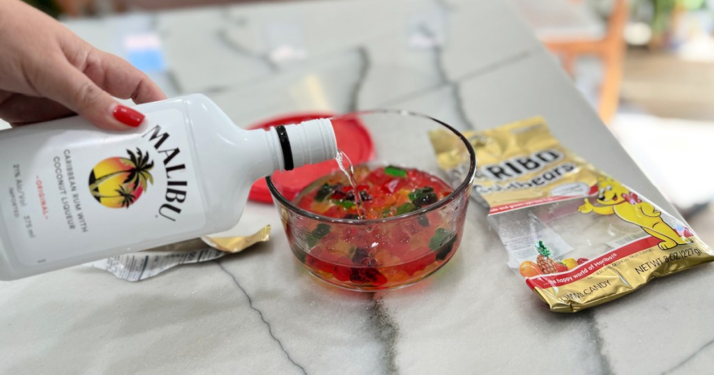 pouring malibu rum on top of gummy bears