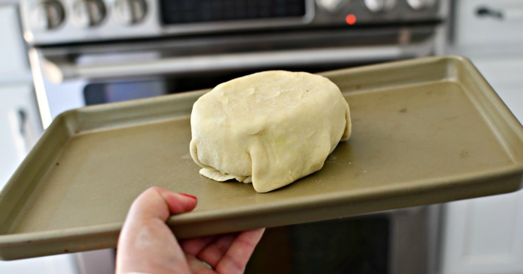 putting baked puff pastry brie in the oven