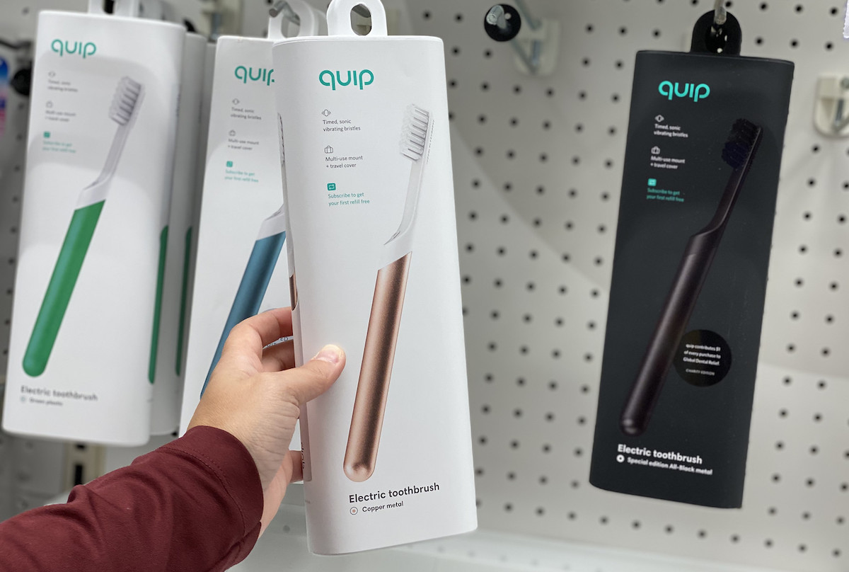 hand holding a quip electric toothbrush box target christmas gifts