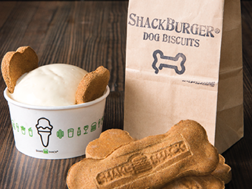 dog ice cream and biscuits on table by paper sack