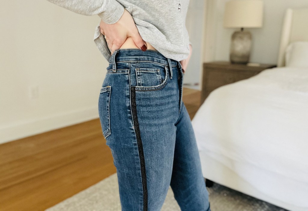 close up of woman wearing jeans