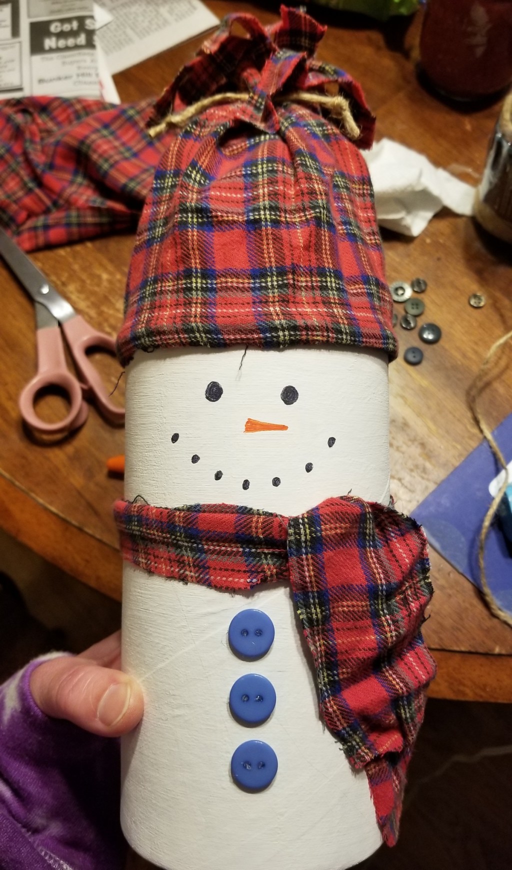holding snowman canister