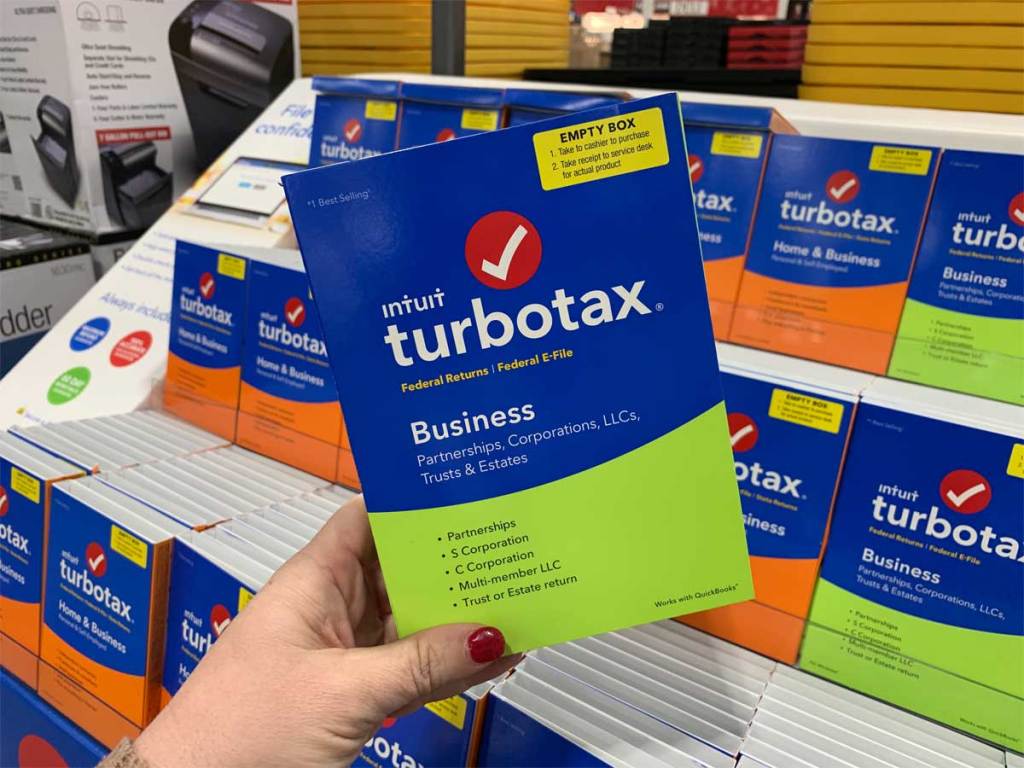hand holding a turbotax software program in store