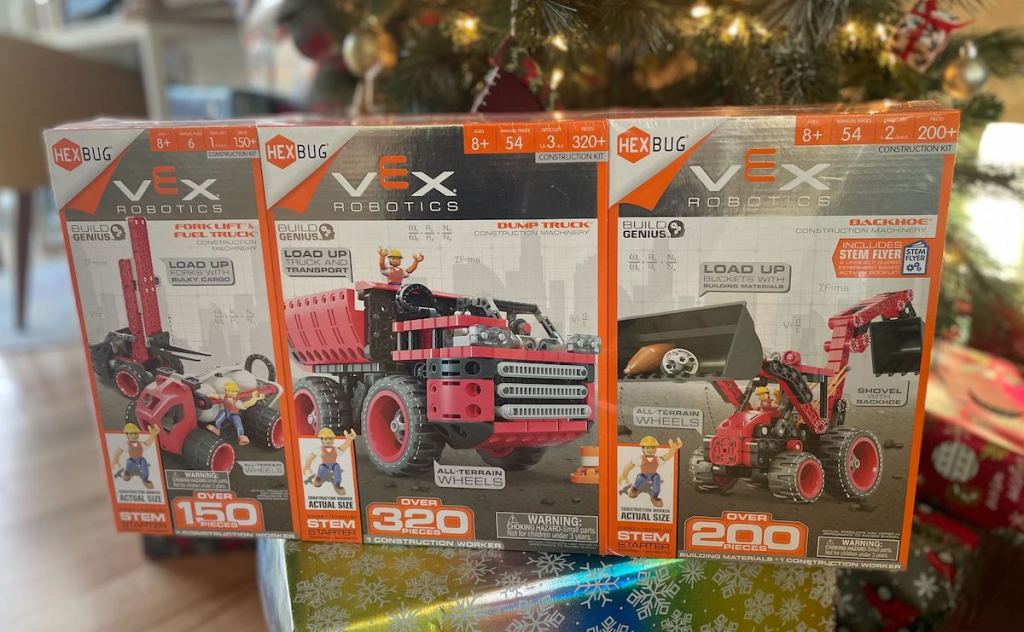 vex robotics box of toy construction vehicles in front of christmas tree