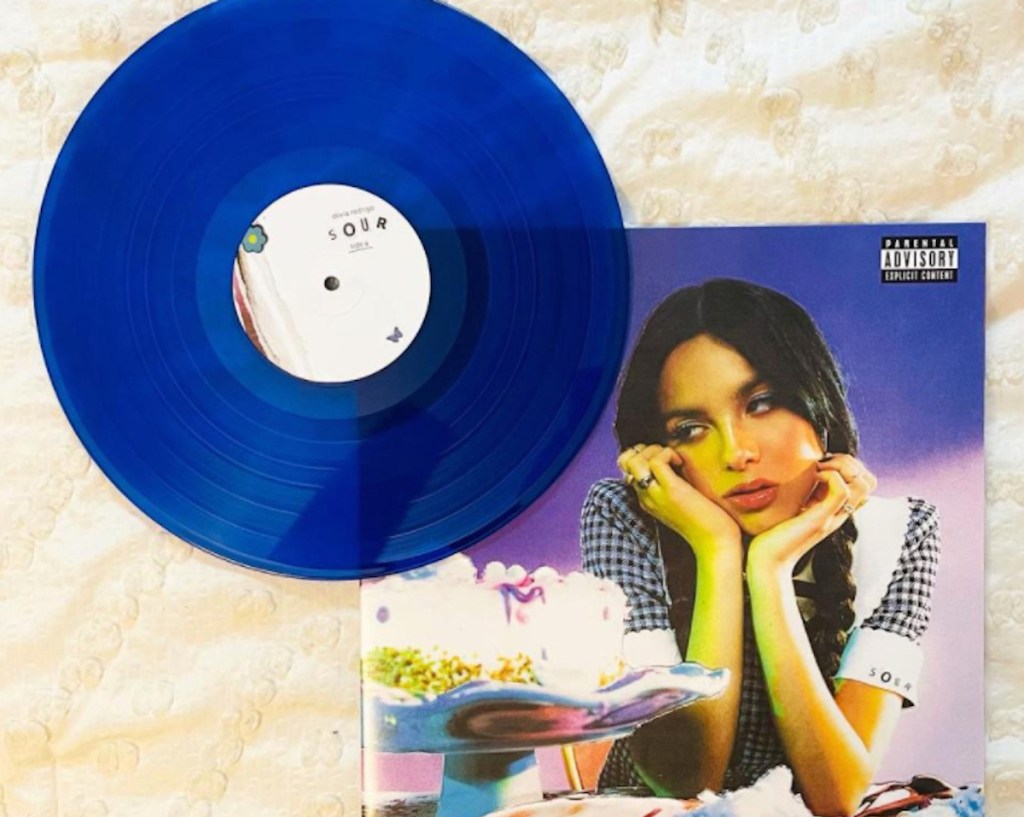 blue vinyl record sitting on blanket