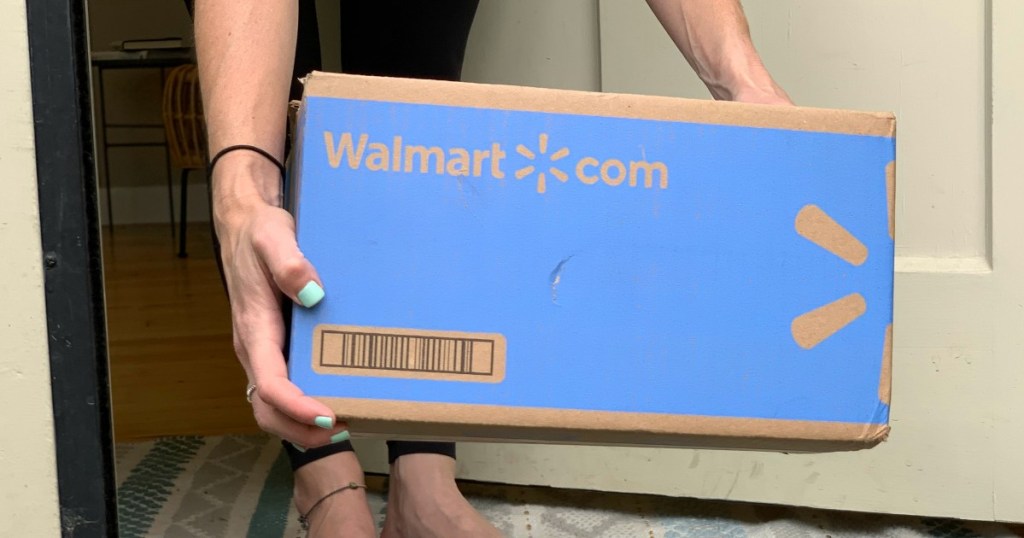 woman holding Walmart box