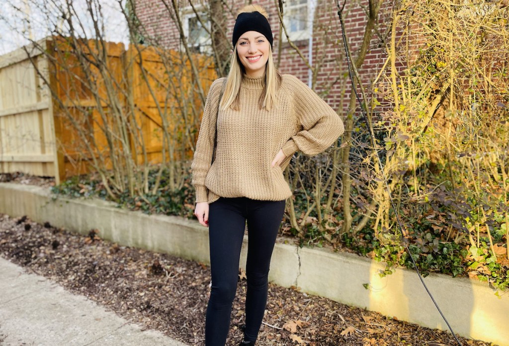 woman wearing black Lululemon leggings dupe and hat with brown sweater
