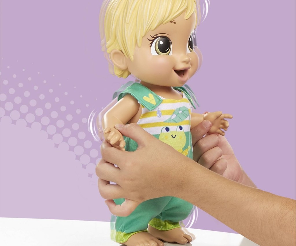 child playing with bouncing baby doll