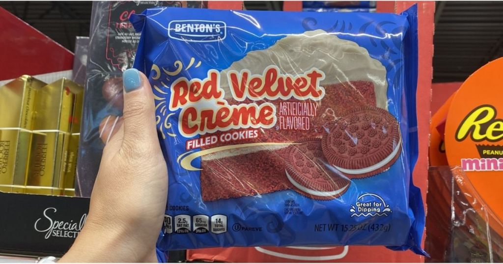 hand holding Benton's Red Velvet Creme-Filled Cookies