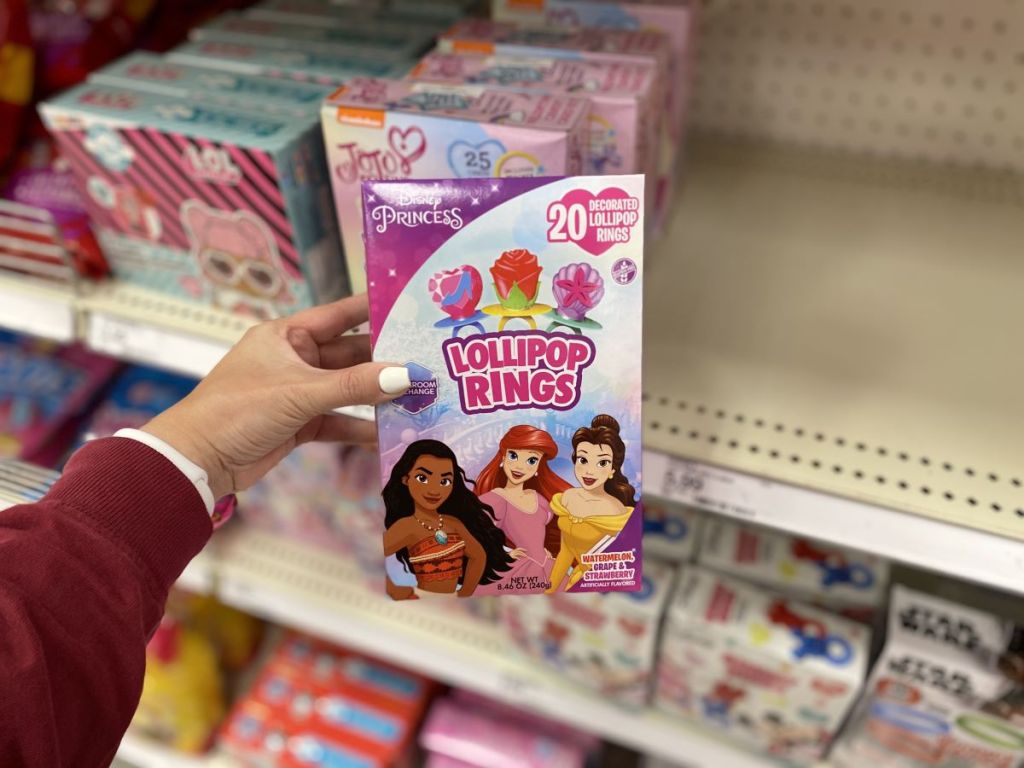 hand holding a box of Disney Princess Lollipop Rings