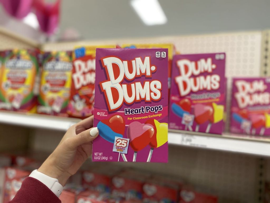 hand holding a box of Dum Dums Heart Pops