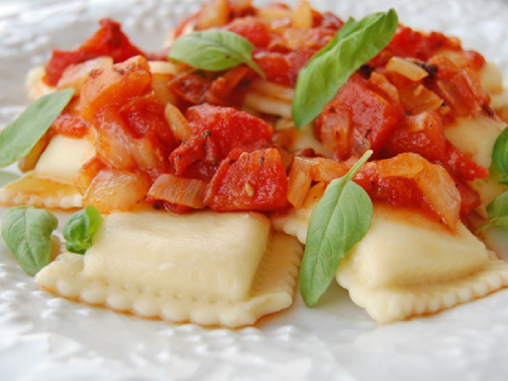 ravioli on a plate with red sauce