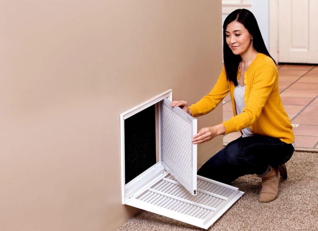woman changing an air filter
