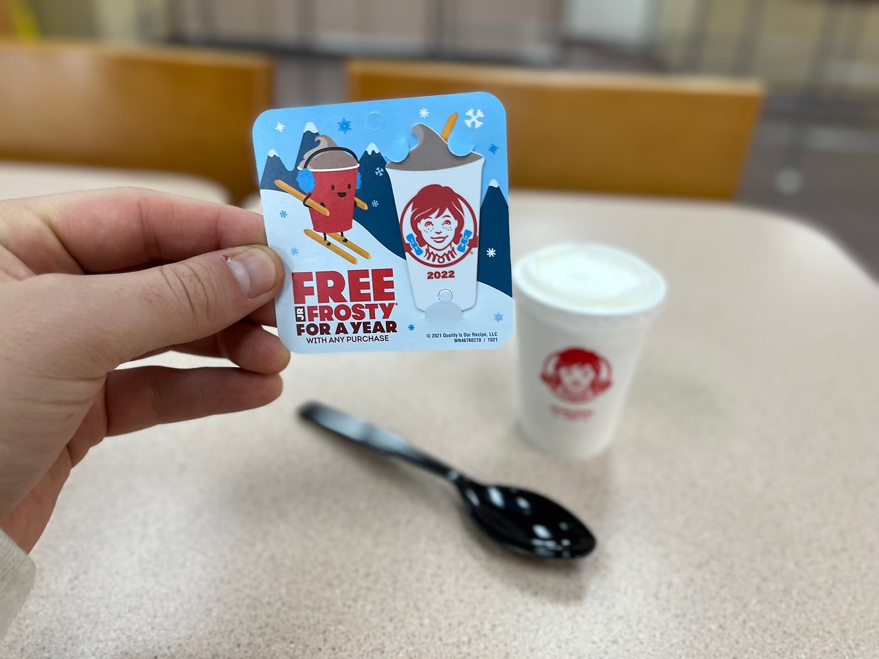 Hand holding Free Frosty Tag 2022
