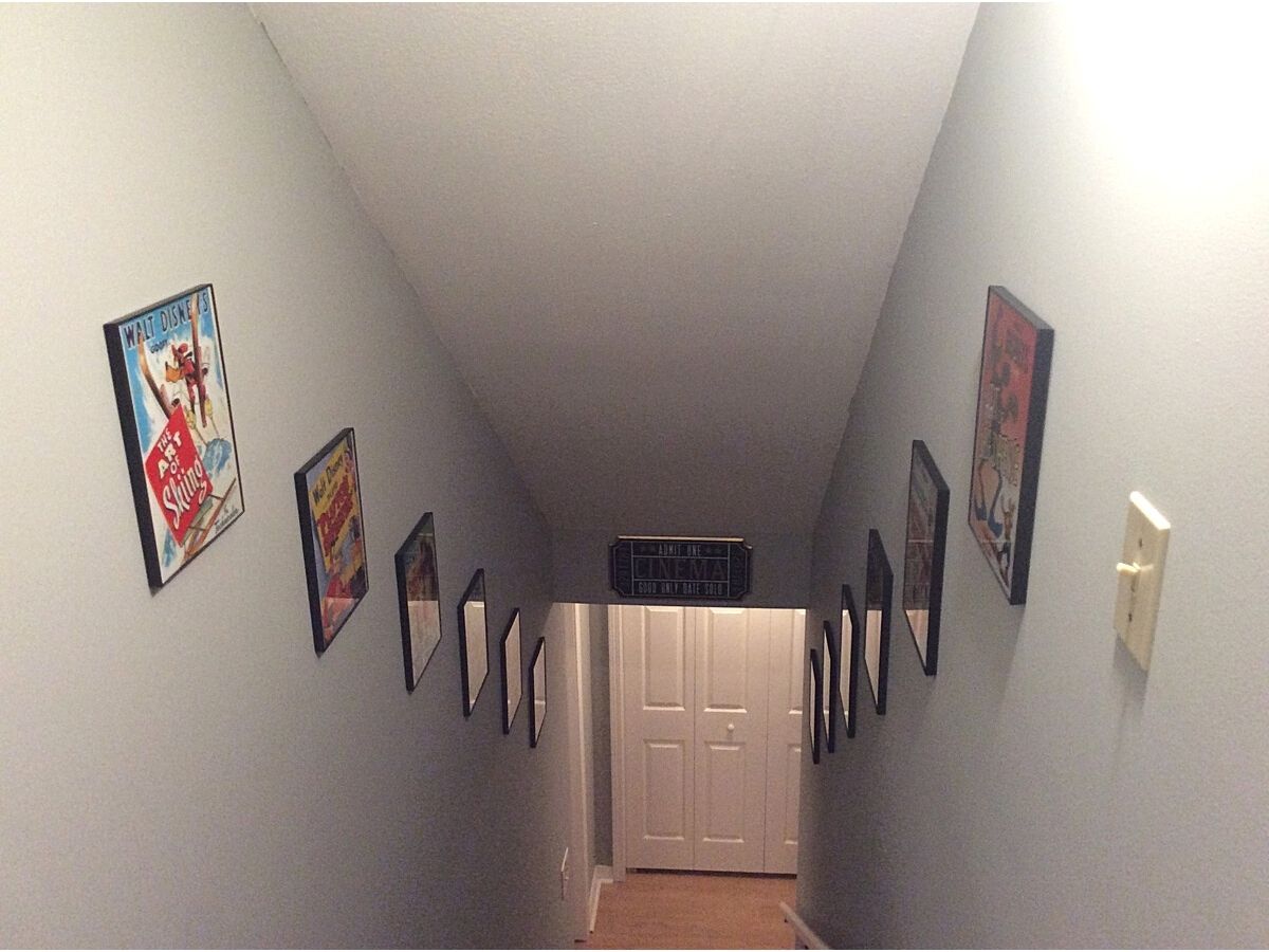 stairway walls covered with framed movie posters