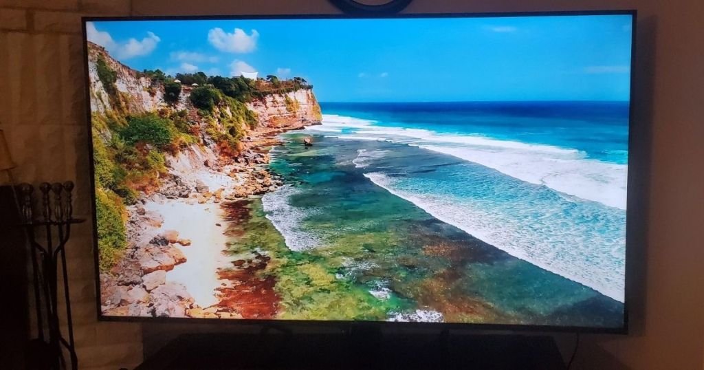 large smart TV with an ocean scene displayed