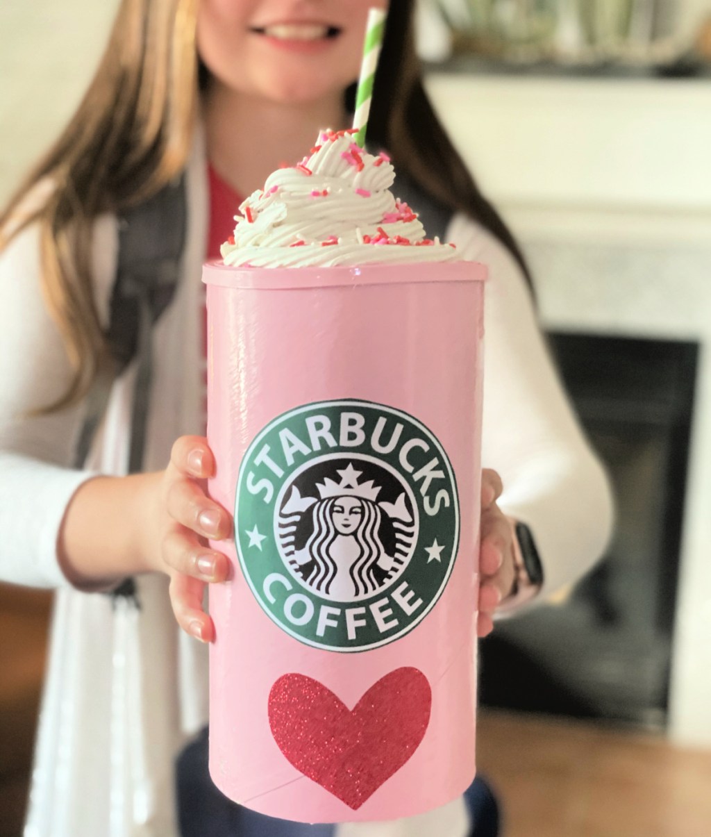 girl holding DIY Starbucks Frappuccino Valentine’s Day Box From An Oatmeal Container