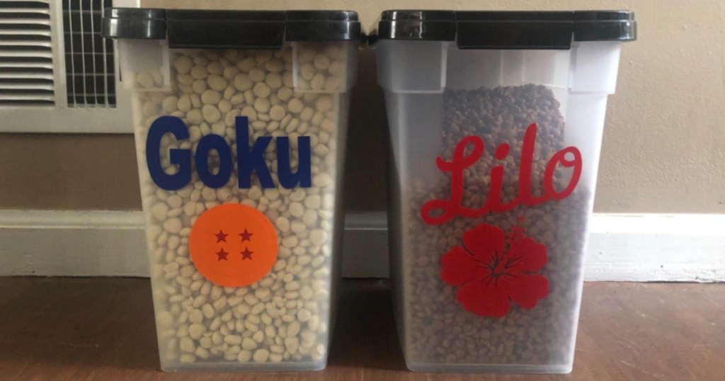 two storage containers filled with pet food on floor