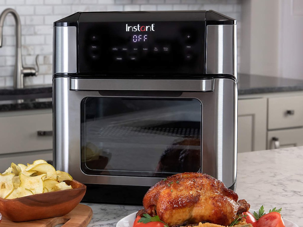 Instant Vortex Pro 10-Quart Air Fryer on kitchen counter next to chicken
