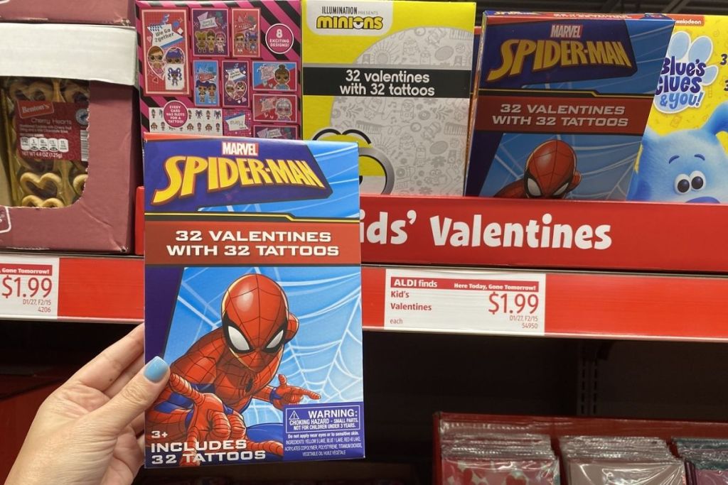 hand holding Kids' Boxed Valentines w/ Tattoos