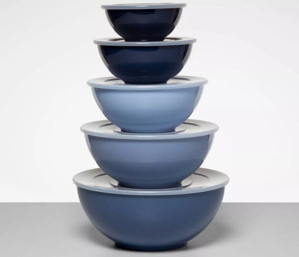 stack of various blue colored mixing bowls