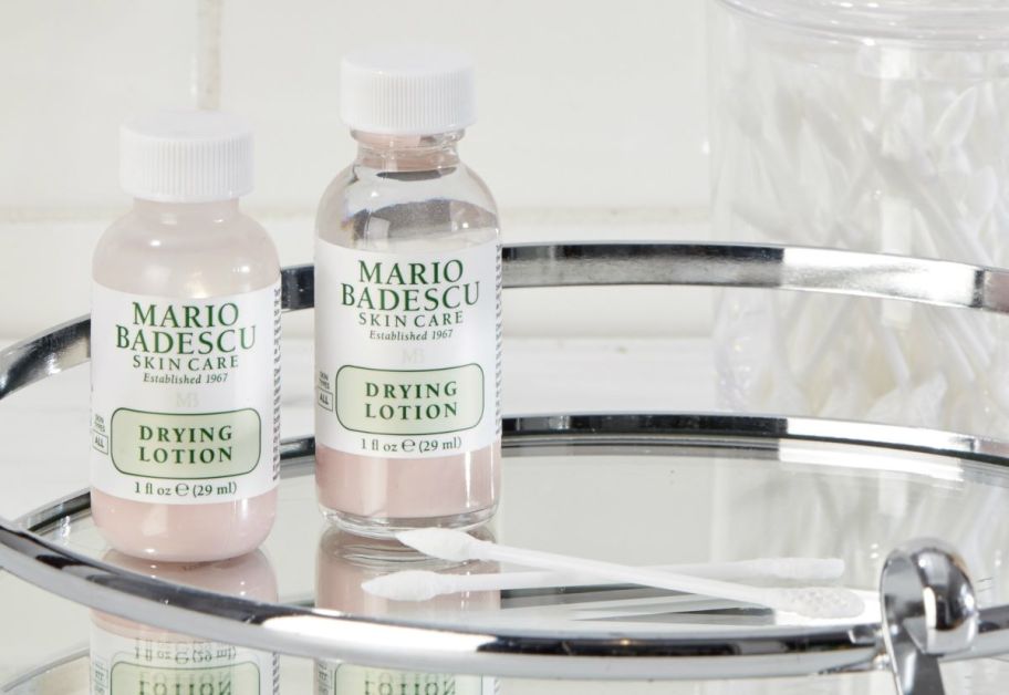 two bottles of Mario Badescu Drying Lotion on a mirror