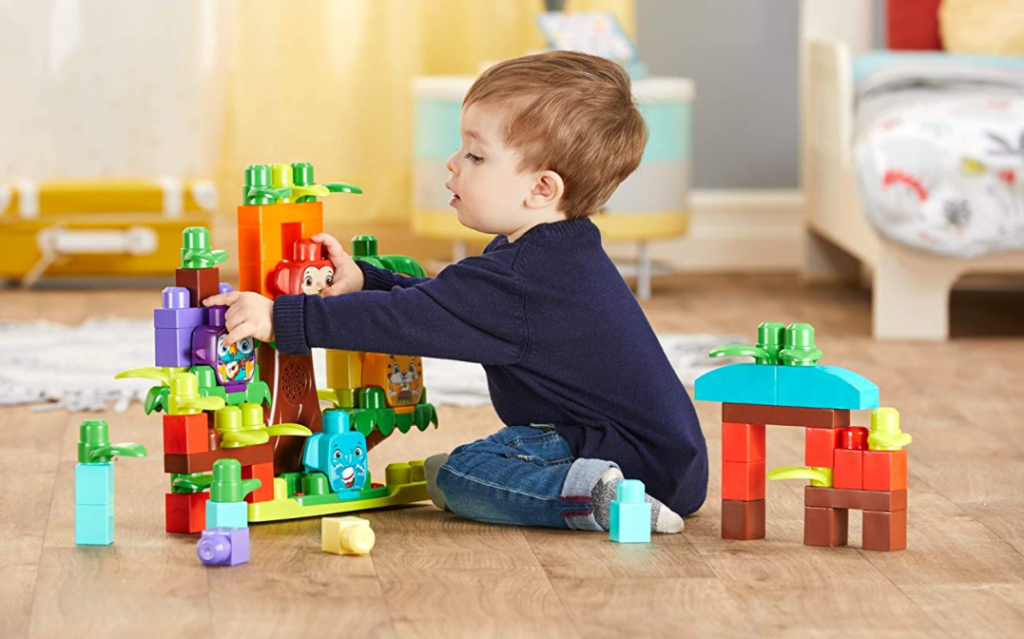 boy playing with the Mega Bloks Jungle Treehouse Set