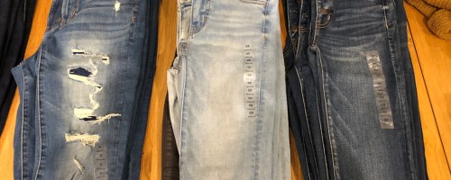 three pairs of american eagle distressed jeans