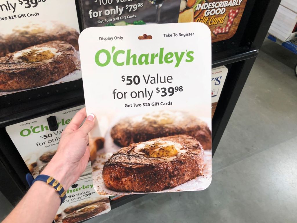 hand holding a large O'Charley's Gift Card