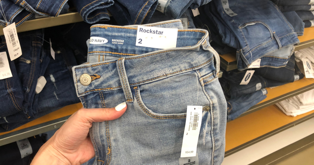 Old Navy brand jeans folded in-hand in-store