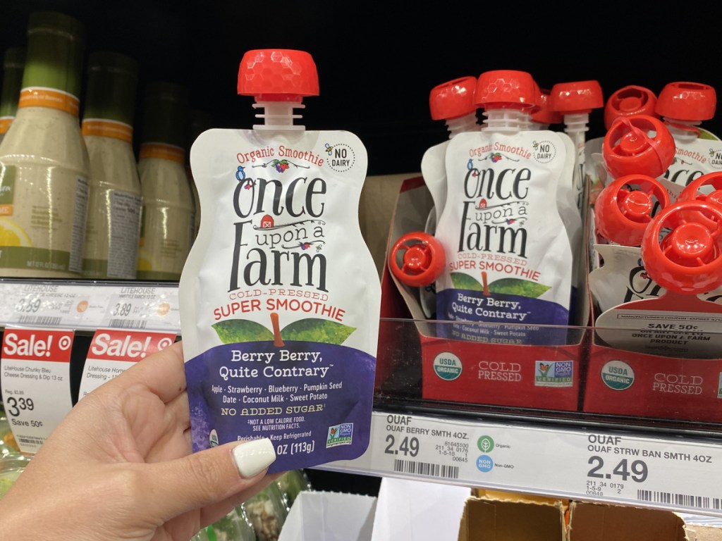 hand holding Once upon a farm organic pouches at target 