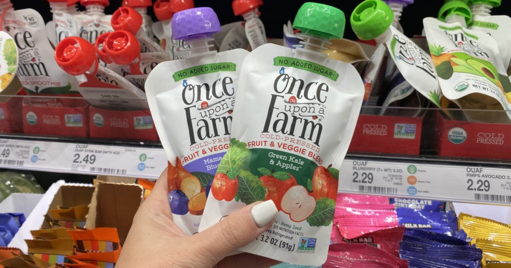 hand holding Once upon a time organic pouches at target 